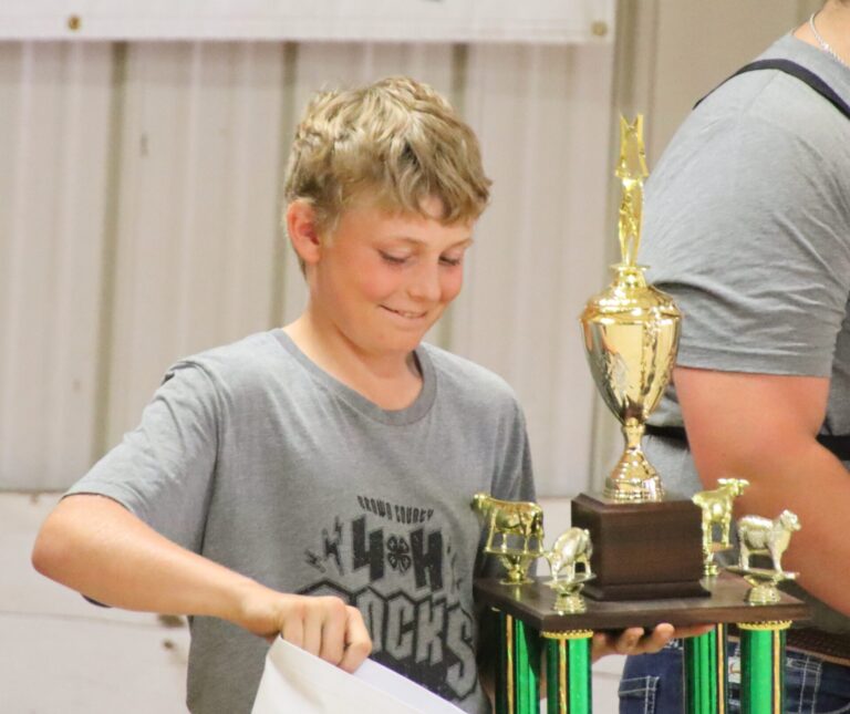 Sutton Stearns accepts the trophy for best all-around showman during the  2024 round robin contest at the Brown County Fair. Aberdeen Insider photo by Elisa Sand.