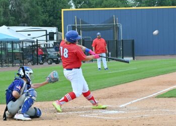 Groton Post 39's Gavin Englund swings and drives the ball to center field in opening round of the American Legion baseball Class B state tournament against Winner-Colome Friday, Aug. 1 at Legion Field in Milbank. Englund flew out, and Groton lost 5-0. Aberdeen Insider photo by Robb Garofalo.