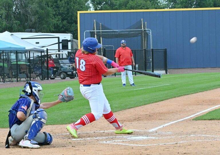 Groton Post 39's Gavin Englund swings and drives the ball to center field in opening round of the American Legion baseball Class B state tournament against Winner-Colome Friday, Aug. 1 at Legion Field in Milbank. Englund flew out, and Groton lost 5-0. Aberdeen Insider photo by Robb Garofalo.