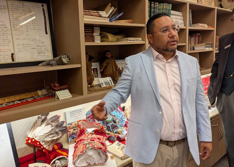 J. Garret Renville, chairman of the Sisseton-Wahpeton Oyate, speaks to visitors from the State-Tribal Relations Committee about the tribe’s artifacts on July 31. South Dakota Searchlight photo by John Hult.