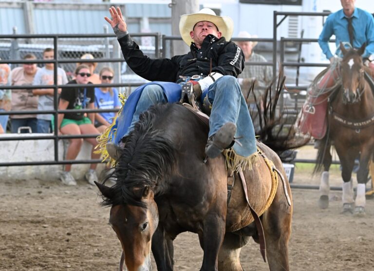 Jamie Howlett of Rapid City by way of Australia rides Target to a first-place finish in the bareback riding event Monday, Aug. 11 at the Dacotah Bank Stampede Rodeo during the Brown County Fair. Aberdeen Insider photo by Robb Garofalo.