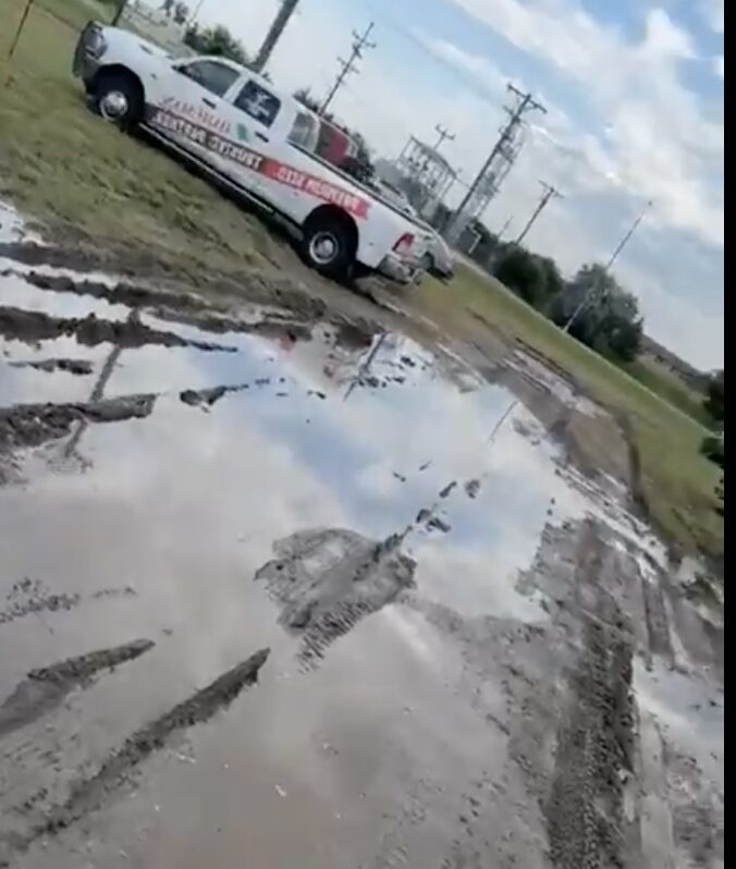 Parking lots on the south side of the Brown County Fairgrounds are a bit muddy. Visitors are asked to park on the north side using gate A or F. Video screenshot from Brown County Fairgrounds Facebook site.