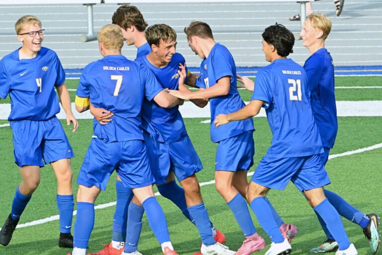 Derek Arunasalam, center, celebrates with his teammates following his goal late in the first half against Pierre on Friday, Aug. 15 at the Brownell Activities Complex. Aberdeen Insider photo by Robb Garofalo.