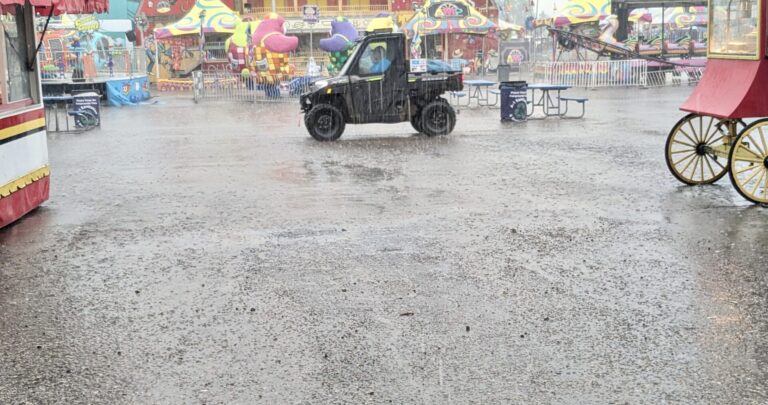 Rain fell on four of the seven days during the 2025 Brown County Fair, sending folks running for cover and leaving areas of water and mud. Aberdeen Insider photo by Scott Waltman.