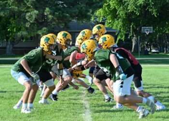The Aberdeen Roncalli football team goes through blocking drills during practice. The Cavaliers opens their season Friday, Aug. 22 at 7 p.m. against Clark/Willow Lake at Dacotah Bank Stadium. Aberdeen Insider photo by Robb Garofalo.