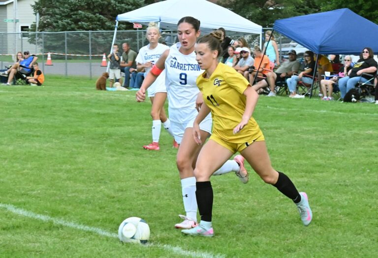 Groton Area's Jerica Locke beats Garretson's Taylor Schmidt to the ball during the first half of their game Thursday, Aug. 28 in Groton. Locke scored her 10th goal of the year in a 4-1 win. Aberdeen Insider photo by Robb Garofalo.