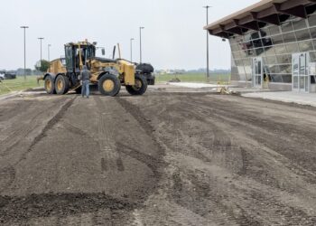 Work continues to resurface the primary access road and parking lot at Aberdeen Regional Airport. Aberdeen Insider photo by Scott Waltman.