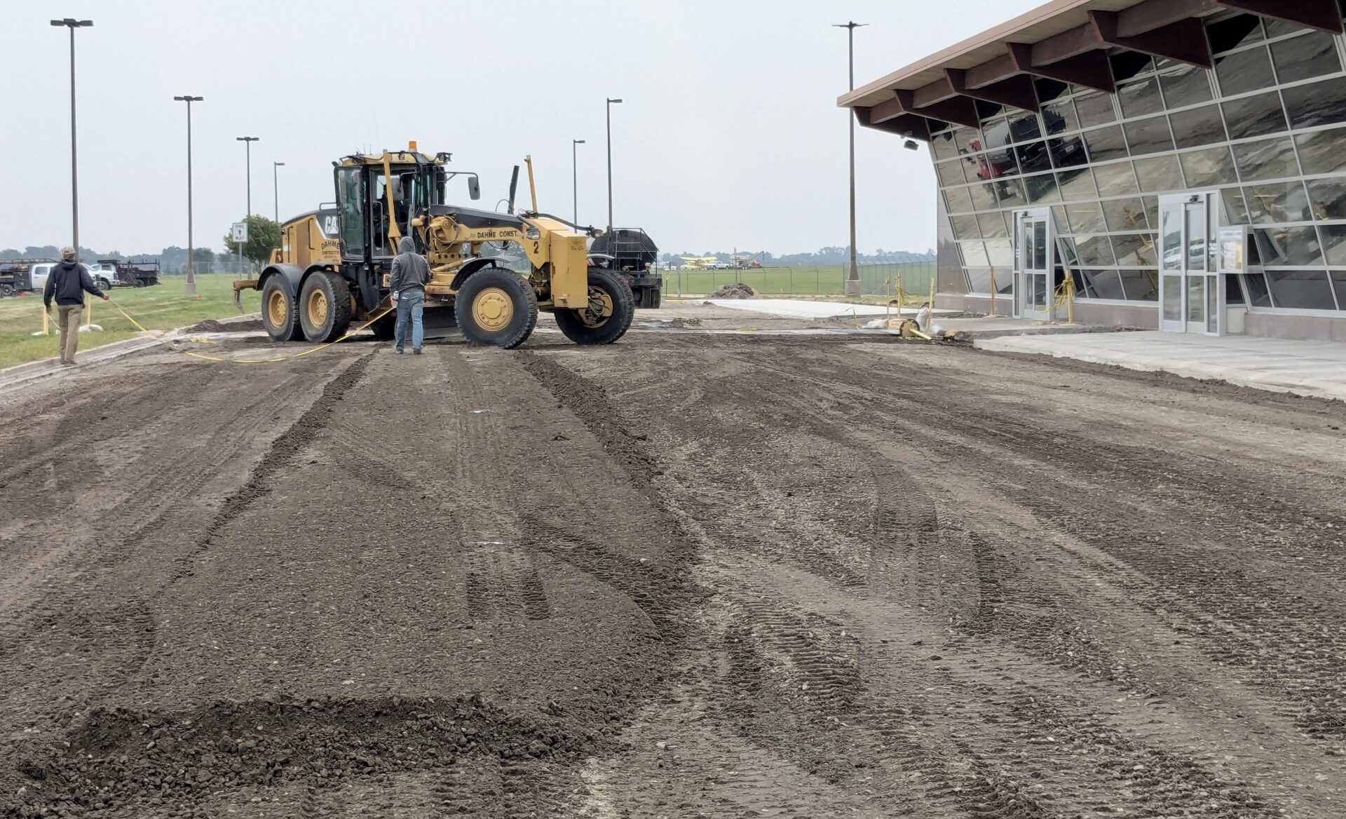 Work continues to resurface the primary access road and parking lot at Aberdeen Regional Airport. Aberdeen Insider photo by Scott Waltman.