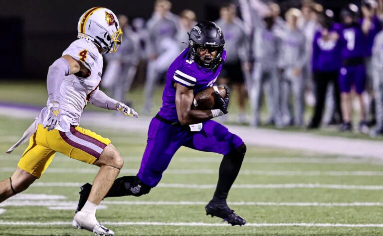 University of Sioux Falls running back Bubba Tann III tries to evade Northern State University defensive back Kyle Thomas as the Cougars picked up a 42-28 victory on Saturday, Sept. 6 in Sioux Falls. Photo courtesy of Jurgens Photography.