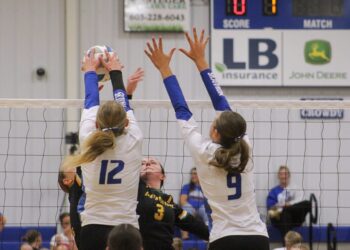 Warner's MaKenna Leidholt (12) gets the block on Northwestern's Breelyn Satter during their match Thursday, Sept. 11 in Warner. Assisting on the block attempt is Molly VanHatten. Northwestern won the match in four sets. Aberdeen Insider photo by Allie Hoekman.