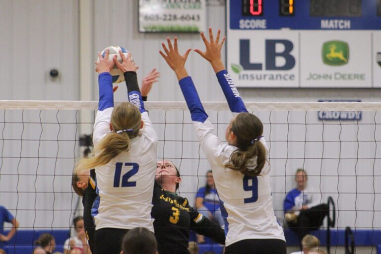Warner's MaKenna Leidholt (12) gets the block on Northwestern's Breelyn Satter during their match Thursday, Sept. 11 in Warner. Assisting on the block attempt is Molly VanHatten. Northwestern won the match in four sets. Aberdeen Insider photo by Allie Hoekman.