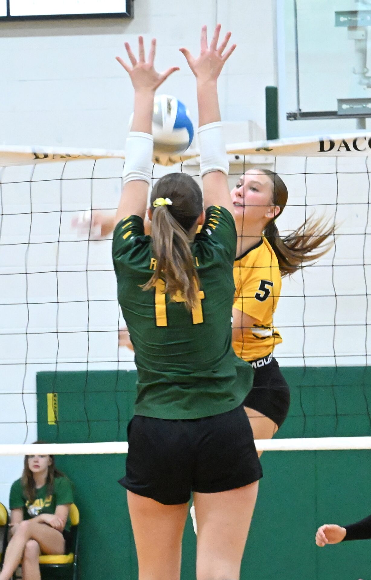 Groton Area's Taryn Traphagen tries to hit through the block attempt of Aberdeen Roncalli's Grace Cogley Thursday, Sept. 11 at the Roncalli Gym. Traphagen had eight kills, helping Groton to the three-set sweep. Aberdeen Insider photo by Robb Garofalo.