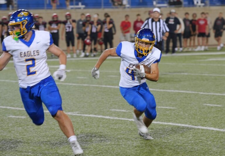 Aberdeen Central's Preston Welke carries the ball during the game against Brookings Friday, Sept. 12 iat Dana Dykhouse J. Stadium in Brookings. Leading the way is teammate Joey Dallman. The Golden Eagles lost 17-14. Aberdeen Insider photo by Kevin Foss.