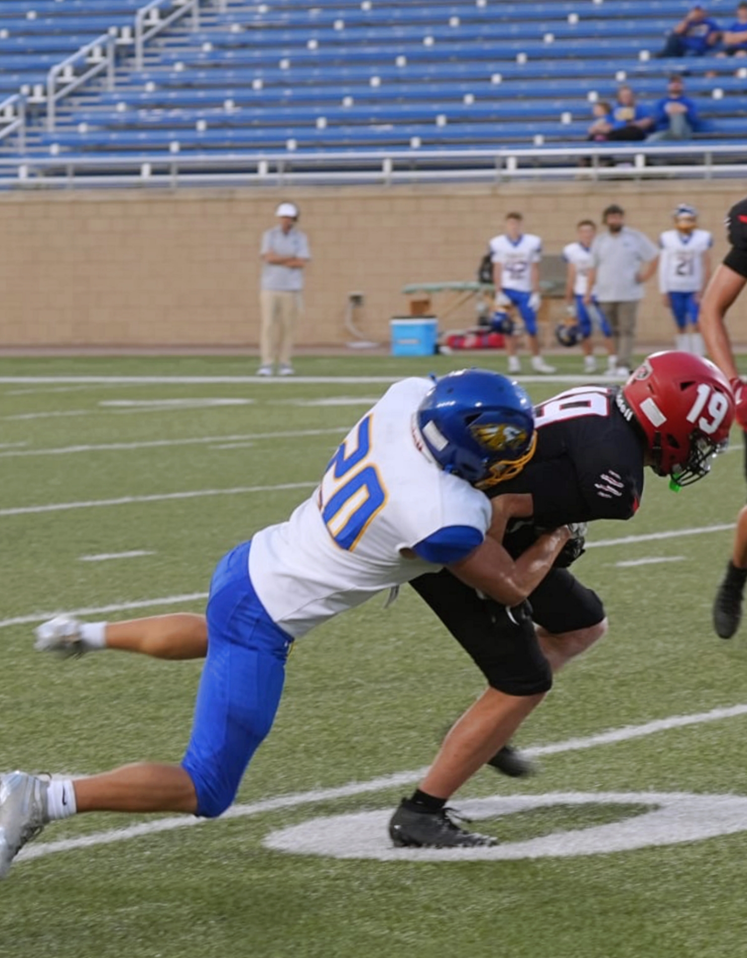 Aberdeen Central's Evan Sichmeller tackles Brookings wide receiver Kingston Schneider during their game Friday, Sept. 12 at Dana J. Dykhouse Stadium in Brookings. Aberdeen Insider photo by Kevin Foss.