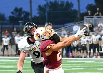 Northern State's Hank Kraft reaches out and makes a catch in the end zone during the Wolves' 26-7 victory over Wayne State on Saturday, Sept. 13 at Dacotah Bank Stadium. Defending for Wayne State is James Frank. Aberdeen Insider photo by Robb Garofalo.