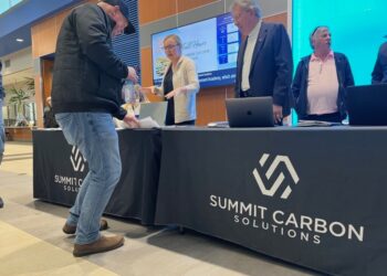 Summit Carbon Solutions representatives pictured at an event in Sioux Falls in January. South Dakota Searchligth photo by Makenzie Huber.