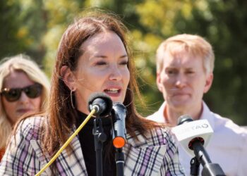 U.S. Secretary of Agriculture Brooke Rollins speaks about the importance of preventing the spread of the New World screwworm on Friday at Express Ranch in Yukon. U.S. Sen. James Lankford, R-Oklahoma, and his wife stand behind Rollins. Oklahoma Voice photo by Emma Murphy.