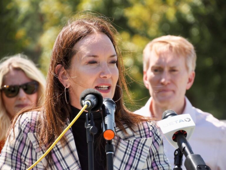 U.S. Secretary of Agriculture Brooke Rollins speaks about the importance of preventing the spread of the New World screwworm on Friday at Express Ranch in Yukon. U.S. Sen. James Lankford, R-Oklahoma, and his wife stand behind Rollins. Oklahoma Voice photo by Emma Murphy.