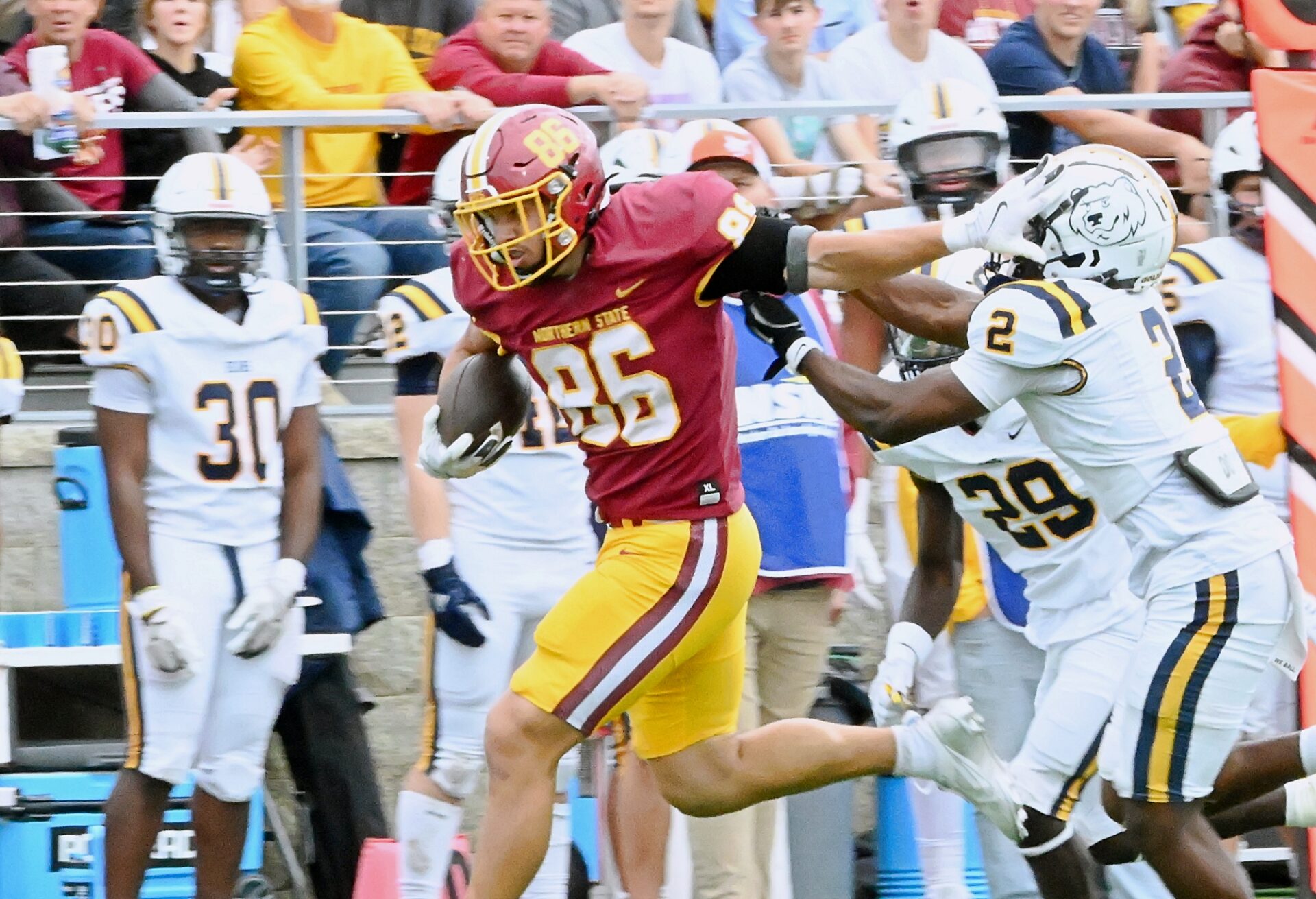 Northern State's Zach Kraft stiff-arms Concordia-St. Paul's Hudson Jean en route to a 46-yard touchdown during the third quarter Saturday, Sept. 20 inside Dacotah Bank Stadium. Kraft had four catches for 70 yards in a 31-10 win. Aberdeen Insider photo by Robb Garofalo.