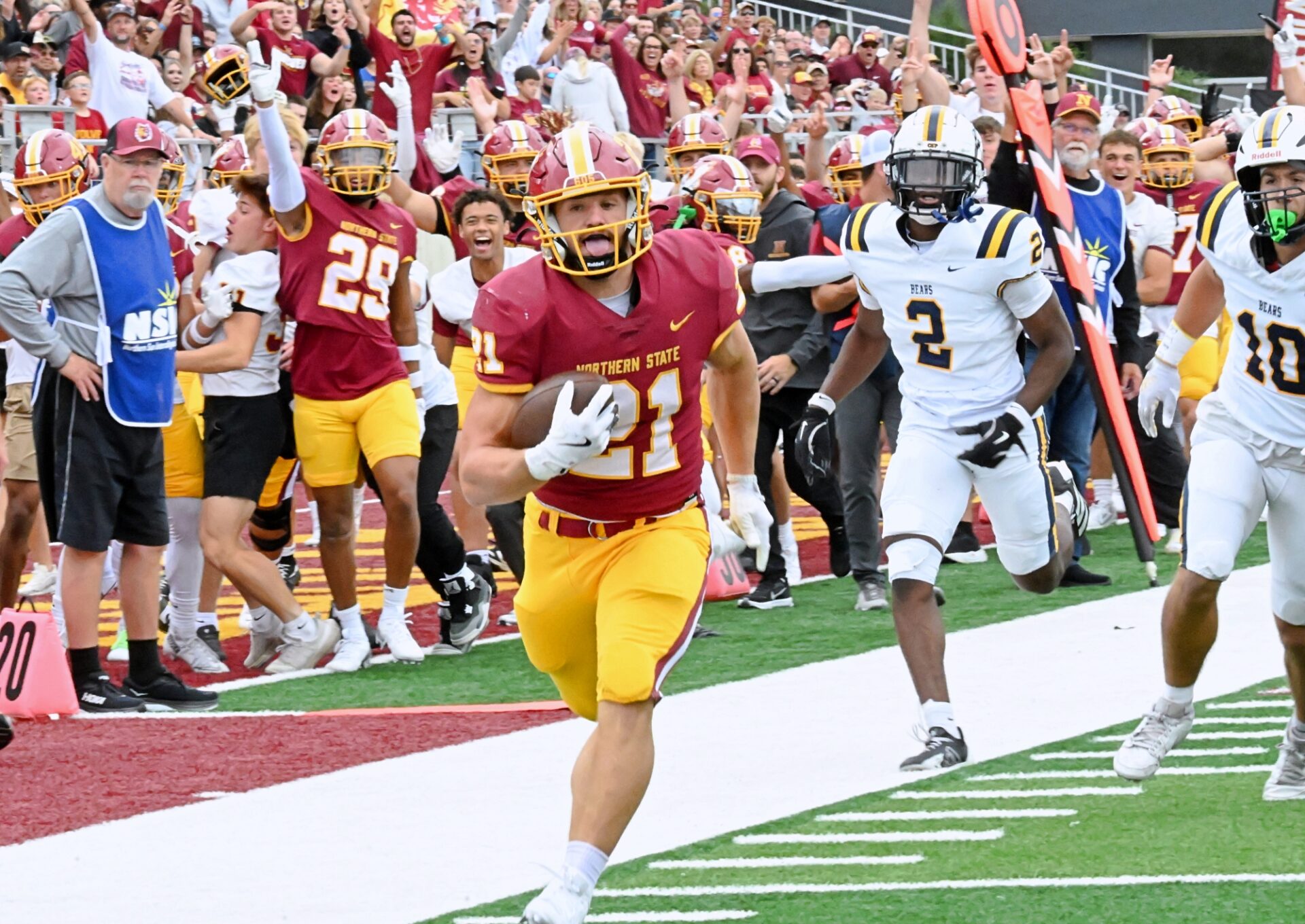 Northern State's Hank Kraft outraces Concordia-St. Paul's Hudson Jean (2) and Ben Rehl to the end zone on a 30-yard catch and run for a touchdown in the first quarter Saturday, Sept. 20 at Dacotah Bank Stadium. Kraft added a rushing touchdown in the Wolves' 31-10 win. Aberdeen Insider photo by Robb Garofalo.