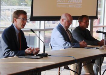 U.S. Rep. Dusty Johnson, R-S.D., left, hosted a roundtable on Tuesday, Sept. 23 in the Kessler's Champions Club on the Northern State campus to discuss artificial intelligence. Bleau LaFave, vice president of asset development and business development at Northwestern Energy, center, and Wes Cummins, chairman and CEO of Applied Digital, were two of the other speakers. Aberdeen Insider photo by Elisa Sand.