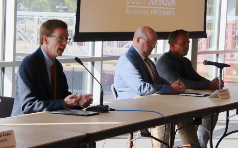 U.S. Rep. Dusty Johnson, R-S.D., left, hosted a roundtable on Tuesday, Sept. 23 in the Kessler's Champions Club on the Northern State campus to discuss artificial intelligence. Bleau LaFave, vice president of asset development and business development at Northwestern Energy, center, and Wes Cummins, chairman and CEO of Applied Digital, were two of the other speakers. Aberdeen Insider photo by Elisa Sand.