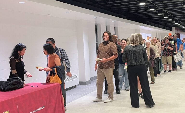 Loung Ung, author of "First They Killed my Father: A Daughter of Cambodia Remembers," at left, visits with attendees following the Common Read lecture at Northern State University on Wednesday, Sept. 24. Aberdeen Insider photo by Reagan Bierschenk.
