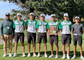 Members of the Aberdeen Roncalli boys golf team pose with the championship trophy after winning the Region 1A Tournament Monday, Sept. 29 in Madison. From left are coach Jon Murdy, Harper Schnabel, Finn Anderson, Lucas Daggett, Jesse Hernandez, Matthew Gerlach and Owen Vogel. Courtesy photo.