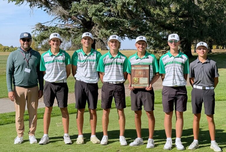 Members of the Aberdeen Roncalli boys golf team pose with the championship trophy after winning the Region 1A Tournament Monday, Sept. 29 in Madison. From left are coach Jon Murdy, Harper Schnabel, Finn Anderson, Lucas Daggett, Jesse Hernandez, Matthew Gerlach and Owen Vogel. Courtesy photo.