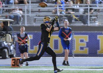 Aberdeen Central's Karson Borge hauls in a 55-yard touchdown pass from Brayden Bowman during the second quarter against Mitchell Friday, Oct. 3 in the Brownell Activities Complex. Borge also had a kickoff return for a score during a 28-13 win. Aberdeen Insider photo by Robb Garofalo.