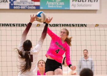 Northwestern's Ashley Haven hits through the block attempt by Aberdeen Christian's Ari Johnson Thursday, Oct. 7 in Mellette. Haven became the program's all-time leader in kills with 1,656, helping the Wildcats to a sweep. Aberdeen Insider photo by Allie Hoekman.