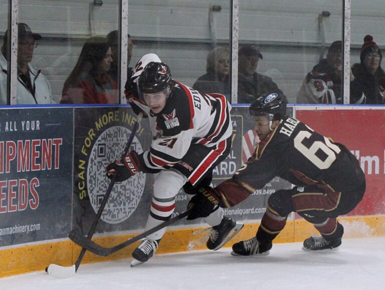 Aberdeen forward Easton Edwards battles Minot defenseman Jakub Habla for the puck during the first period Saturday, Oct. 11 at the Odde Ice Center. Edwards had two goals in the Wings 5-0 win. Aberdeen Insider photo by Allie Hoekman.