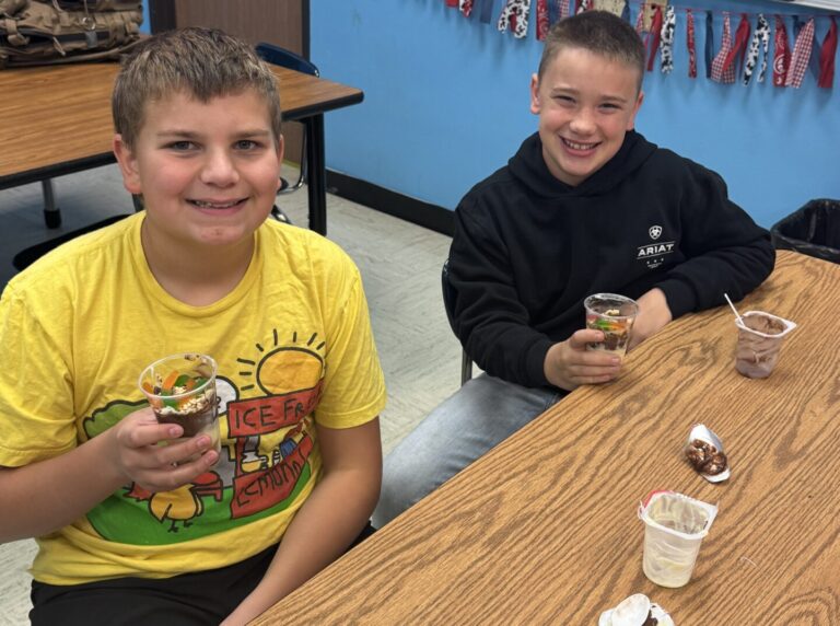 Frederick students Dawson Clark and Charlie Foley make edible soil layers as part of the school's agriculture program. Courtesy photo.