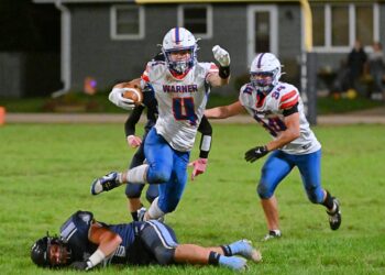 Warner's Jesiah Baum leaps over Leola/Frederick's Jacob Kindlespire during the fourth quarter of their game Friday, Oct. 17 in Frederick. Baum scored four touchdowns in a 33-6 Monarch win. Aberdeen Insider photo by Robb Garofalo.