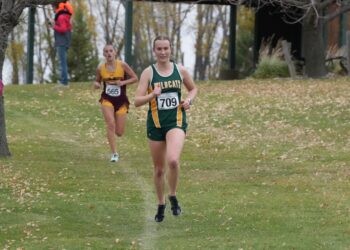 Northwestern's Ella Boekelheide keeps distance between herself and Deubrook Area's Nora Olsen during the girls Class B state cross-country meet Saturday, Oct. 25 in Huron. Boekelheide won her second-straight state title and third overall. Aberdeen Insider photo by Kevin Foss.