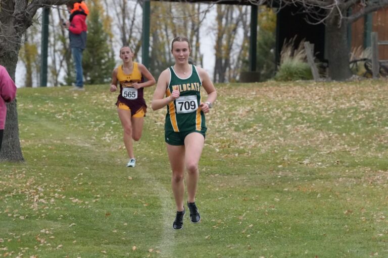 Northwestern's Ella Boekelheide keeps distance between herself and Deubrook Area's Nora Olsen during the girls Class B state cross-country meet Saturday, Oct. 25 in Huron. Boekelheide won her second-straight state title and third overall. Aberdeen Insider photo by Kevin Foss.