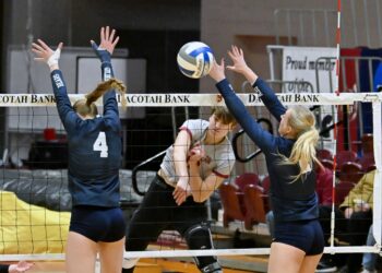 Northern State's Natalia Szybinska rips a spike through the block attempt by Concordia-St. Paul's Mehlayna Straub (4) and Audrey Waterman Saturday, Nov. 1 at Wachs Arena. The Wolves were swept by the ninth-ranked Golden Bears. Aberdeen Insider photo by Robb Garofalo.