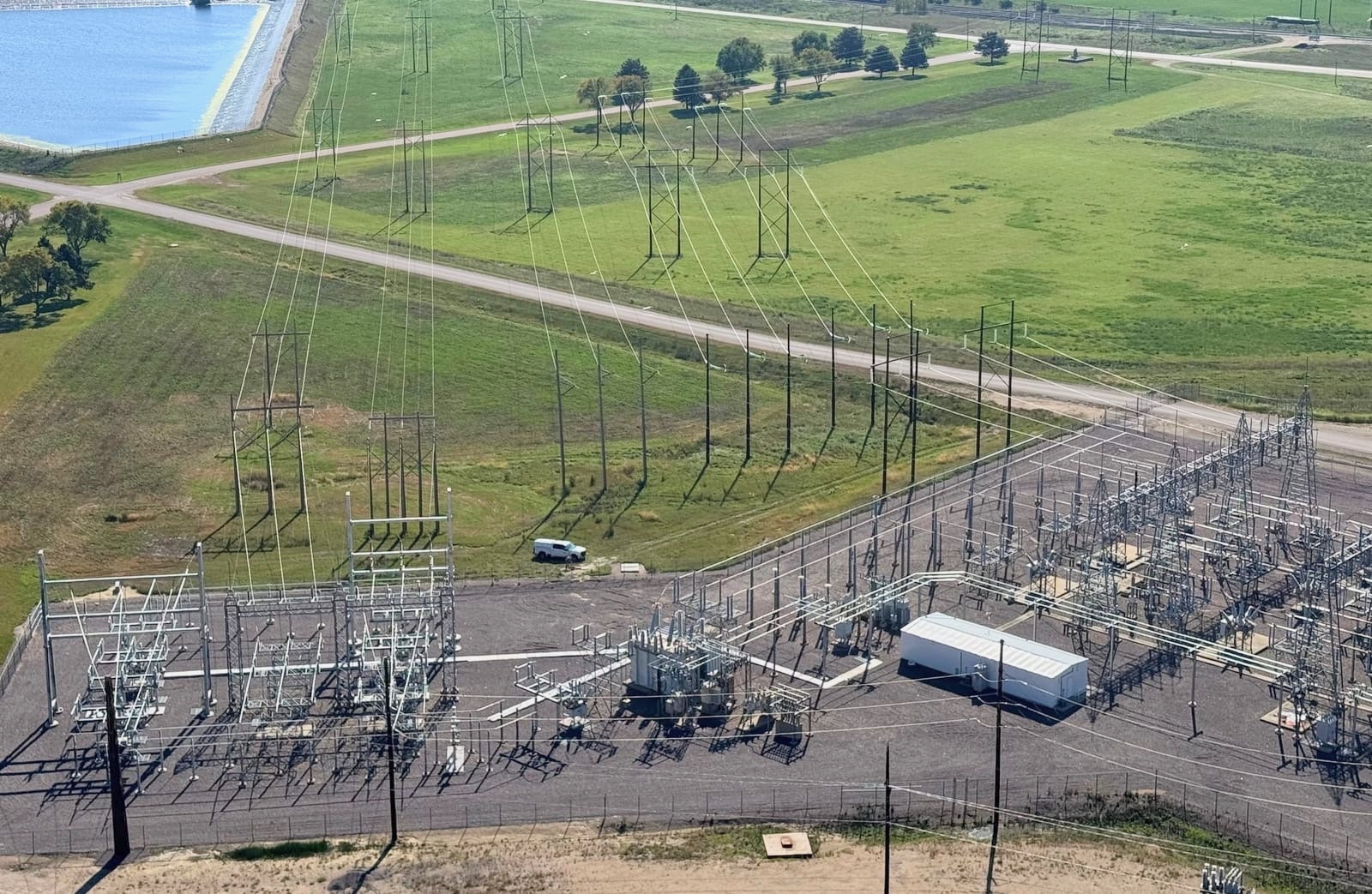 These 230-kilovolt power lines carry electricity generated by the Otter Tail Power Co. plant in Big Stone City, shown on Sept. 25. Big Stone City could see development of a 765-kilovolt power line in the coming years. South Dakota News Watch photo by Bart Pfankuch.