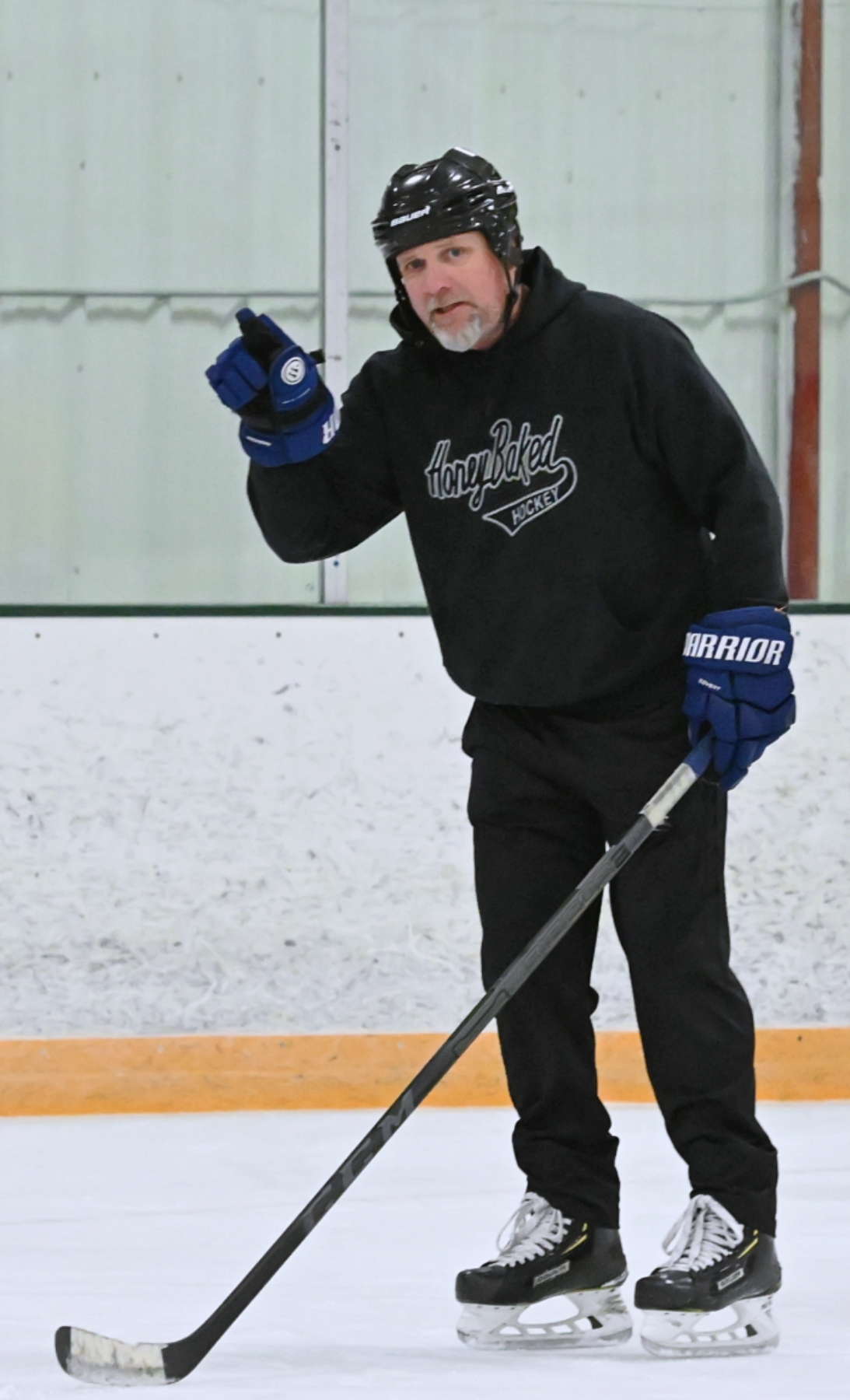 Coach Dana Myhre discusses puck retrieval during an Aberdeen Cougars hockey practice inside the Holum Expo Building. Aberdeen Insider photo by Robb Garofalo.