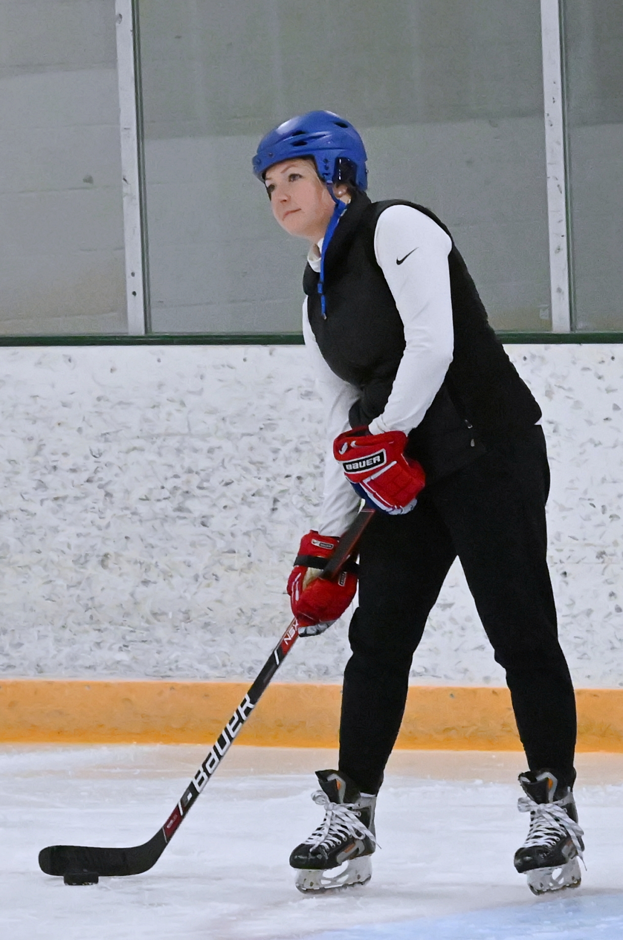 Amy Munsterman-Wills sends the puck to the middle of the ice during an offensive zone drill during practice at the Holum Expo Building. Aberdeen Insider photo by Robb Garofalo.