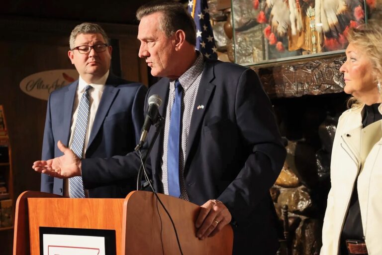 South Dakota Gov. Larry Rhoden, center, officially announced plans to seek re-election on Tuesday, Nov. 18 in Rapid City. Standing with him is Lt. Gov. Tony Venhuizen and his wife, Sandra. Dakota Scout photo by Joe Sneve.