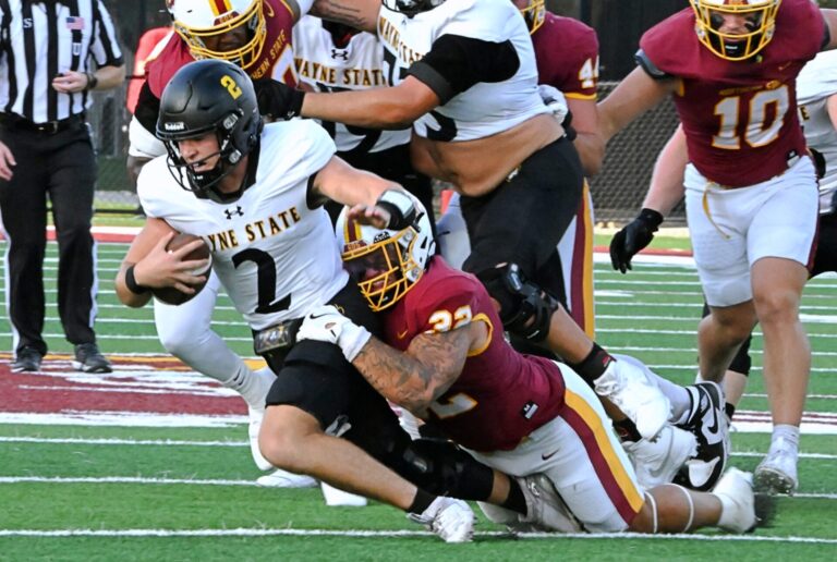 Northern State's Gabe Gutierrez sacks Wayne State quarterback Bennett Dannenbring during their game Saturday, Sept. 13 at Dacotah Bank Stadium. Gutierrez was selected to the NSIC all-conference first team. Aberdeen Insider photo by Robb Garofalo.