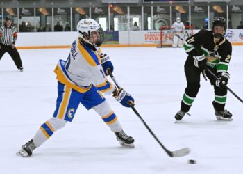 Aberdeen forward Briggs Medill takes a shot on goal during the second period against Oahe on Sunday, Nov. 23 in the Odde ice Center. The Cougars lost 6-2. Aberdeen Insider photo by Robb Garofalo.