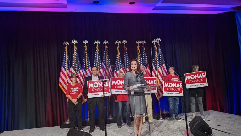Secretary of State Monae Johnson celebrates her Nov. 8, 2022, election victory with SD Canvassing’s Rick Weible and Gretchen Weible, who served as Johnson’s campaign manager in her first run for the office. South Dakota Searchlight photo by John Hult.