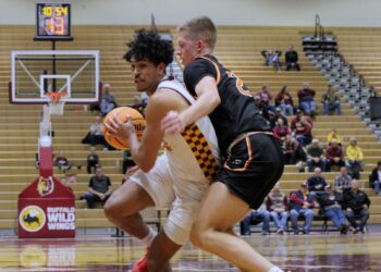 Northern State's Ty Rogers drives to the basket on Jamestown's Owen Hektner during the first half of their game Wednesday, Nov. 26 at Wachs Arena. Rogers had eight points in a 74-71 win. Aberdeen Insider photo by Allie Hoekman.