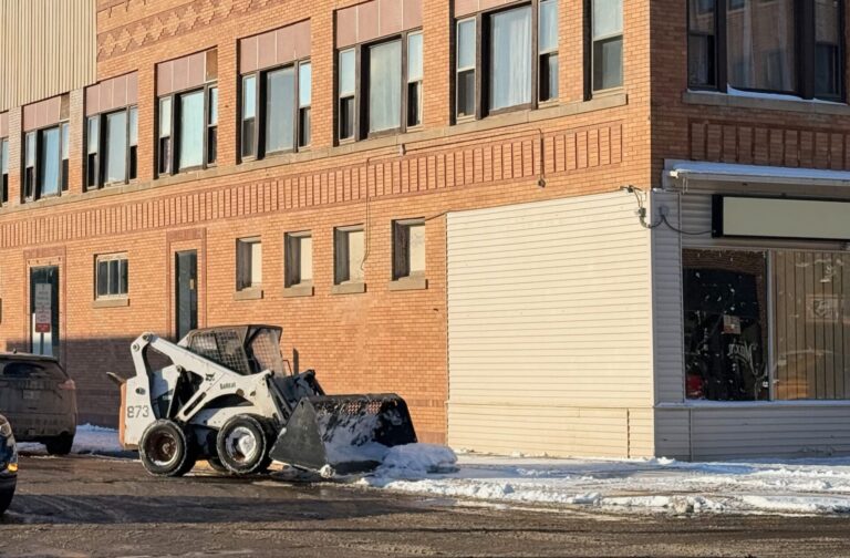 Clearing of sidewalks continued into the afternoon of Monday, Dec. 1 after more than 8 inches of weekend snow. Aberdeen Insider photo by Elisa Sand.