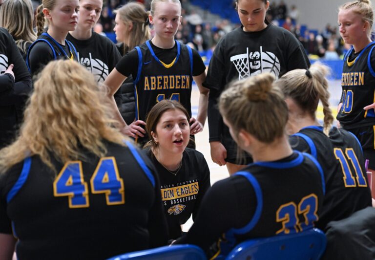 Aberdeen Central head girls basketball coach Paiton Burckhard addresses her team during a timeout against Sioux Falls O'Gorman last season. Burckhard begins season two leading the Golden Eagles with higher expectations. Aberdeen Insider photo by Robb Garofalo.