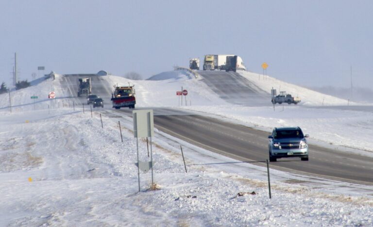 A semi slid partially off an eastbound overpass along U.S. Highway 12 west of Groton on Thursday, Dec. 4. Nobody was injured, but the bridge was closed for about three hours. Photo courtesy of  Lynn Aman.