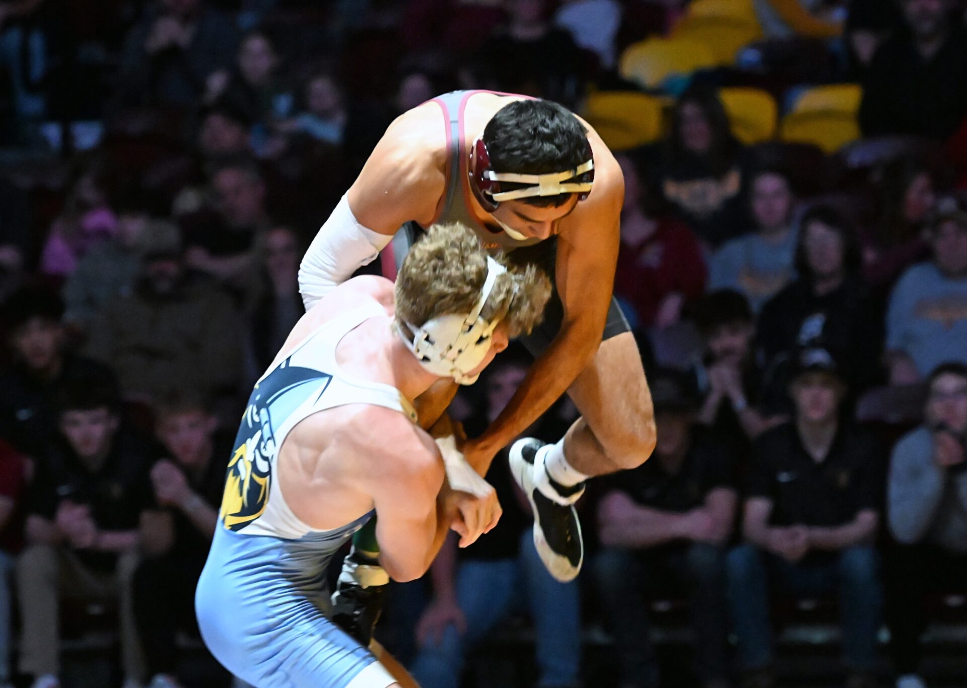 Northern State's Rudy Lopez jumps as he attempts to free his leg against Augustana's Nolan Ambrose during their 149-pound match Thursday, Dec. 4 inside Wachs Arena. Ambrose won the match 13-10 as the Vikings picked up the dual victory. Aberdeen Insider photo by Allie Hoekman.