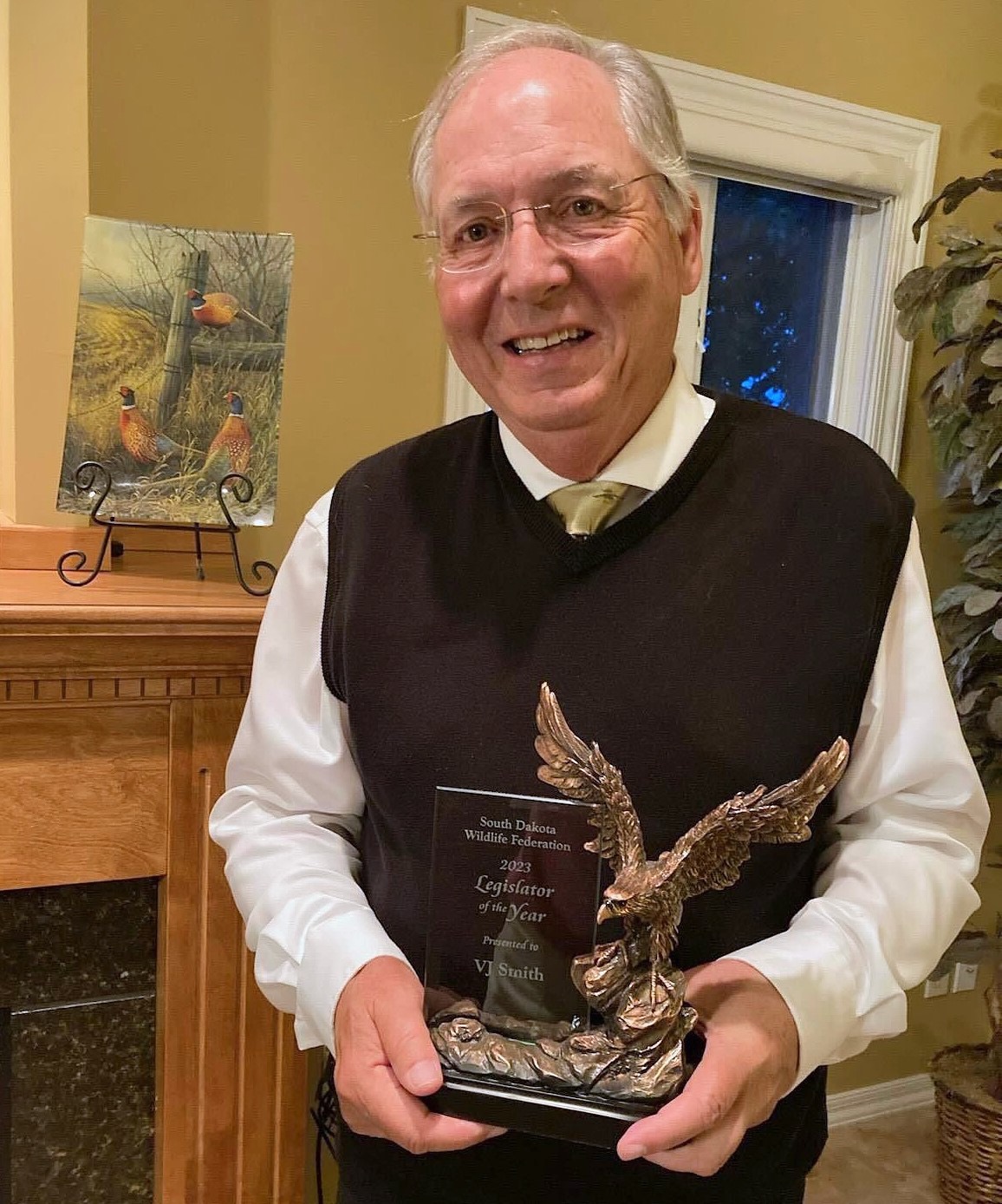 Former state Sen. V.J. Smith, a Republican from Brookings, holds up the “Legislator of the Year” award given to him by the South Dakota Wildlife Federation for his legislation that created the state’s Habitat Stamp program. Photo courtesy of V.J. Smith.